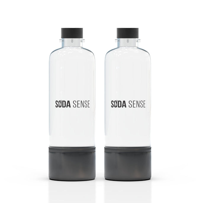 Two clear Soda Sense reusable bottles with black caps and bases, standing side by side on a white background.