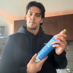 A customer examines a Soda Sense refill box, demonstrating the company's refill service for CO2 canisters from different brands.